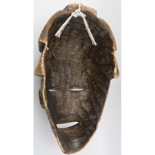 217 - Tribal Art: An African carved wood mask, probably Ivory Coast. 42 cm height. 
Condition report: Some... 