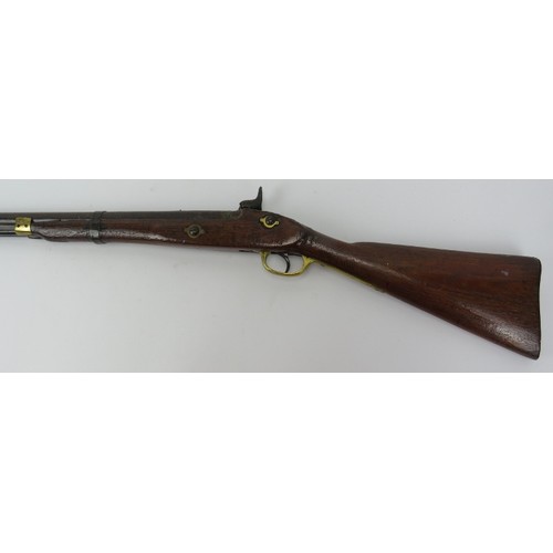 218 - A percussion cap rifle, 19th century. Probably an Enfield rifle. With brass guard and mounts, the ca... 