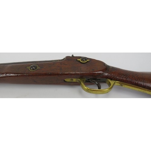 218 - A percussion cap rifle, 19th century. Probably an Enfield rifle. With brass guard and mounts, the ca... 