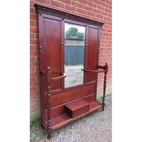 748 - A late Victorian mahogany hall stand of usable proportions, the dentil cornice above a bevelled mirr... 