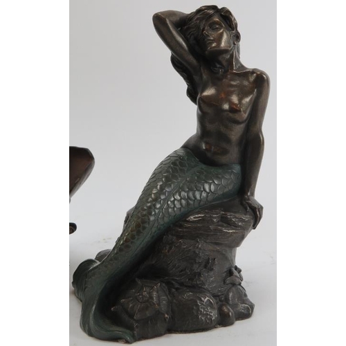 300C - A group of three bronzed erotic female figures, late 20th century. Comprising a mermaid on a rock, a... 