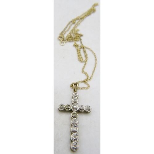 500D - A 9ct yellow gold crucifix set with twelve small diamonds on a fine chain, clasp 9ct, diamonds appro... 