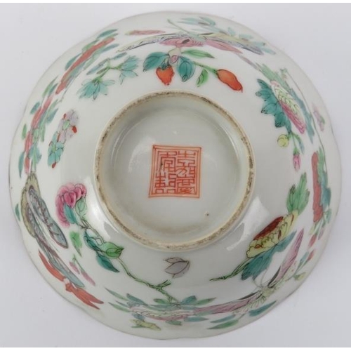 10 - A Chinese famille rose cup and saucer, early 19th century. Both decorated with butterflies amongst f... 