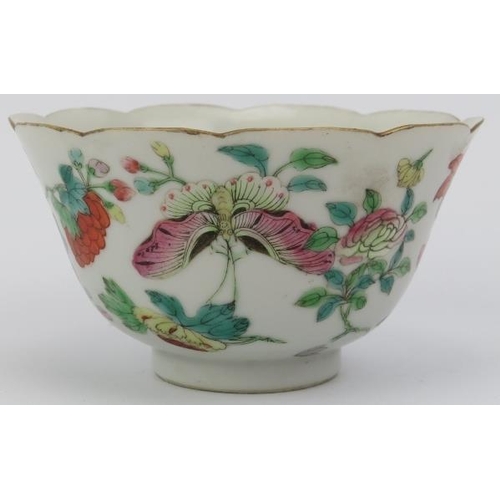 10 - A Chinese famille rose cup and saucer, early 19th century. Both decorated with butterflies amongst f... 