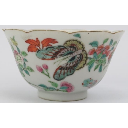 10 - A Chinese famille rose cup and saucer, early 19th century. Both decorated with butterflies amongst f... 