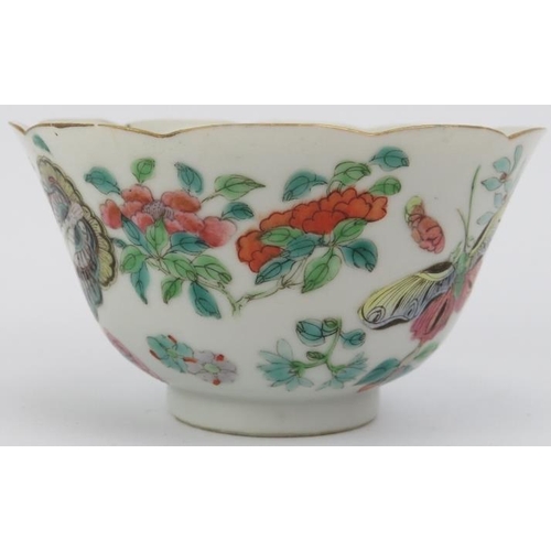 10 - A Chinese famille rose cup and saucer, early 19th century. Both decorated with butterflies amongst f... 