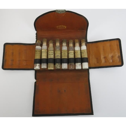 259 - A vintage First Aid kit, medicine glasses and apothecary bottle in a case. (Quantity). 
Condition re... 