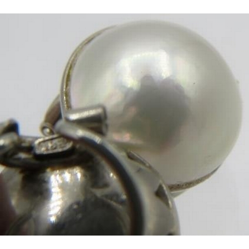 345 - A pair of 18ct white gold Mabe pearl earrings with spring backs. Pearl approx 18mm across, approx we... 