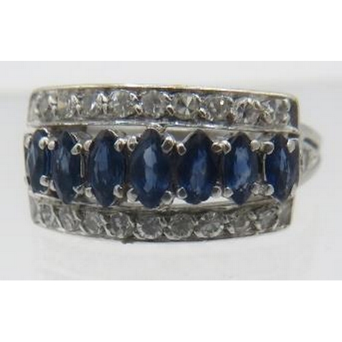 349 - A fine white metal sapphire & diamond ring. Seven marquise cut sapphires, approx 5mm x 3mm in centre... 