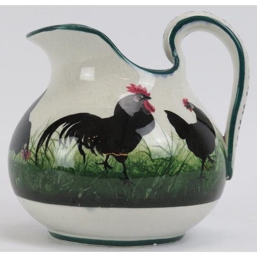 5 - A Wemyss ware jug decorated with black hens and cockerels. Signed beneath. 16 cm height.
Condition r... 