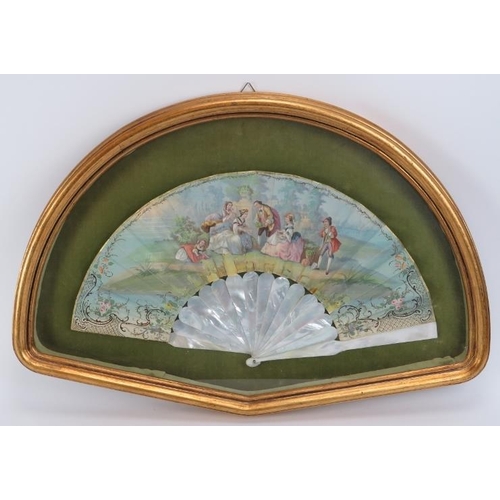 67 - A hand painted mother of pearl fan, probably French, 19th century. Decorated depicting a figural gar... 