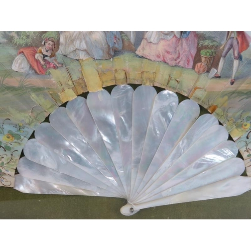 67 - A hand painted mother of pearl fan, probably French, 19th century. Decorated depicting a figural gar... 