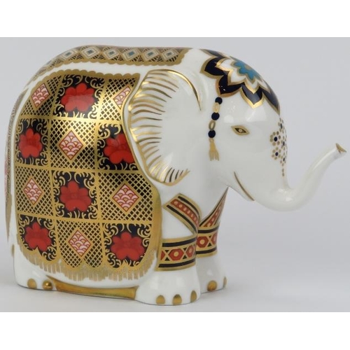 71 - A Royal Crown Derby porcelain elephant paperweight figurine. Stopper and factory marks beneath. 10.3... 