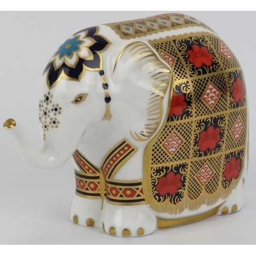 71 - A Royal Crown Derby porcelain elephant paperweight figurine. Stopper and factory marks beneath. 10.3... 