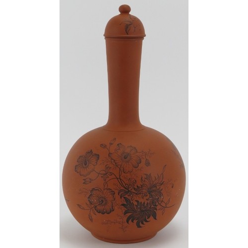 262 - A Victorian Watcombe terracotta bottle vase and cover with floral decoration, circa 1880s. 29 cm hei... 