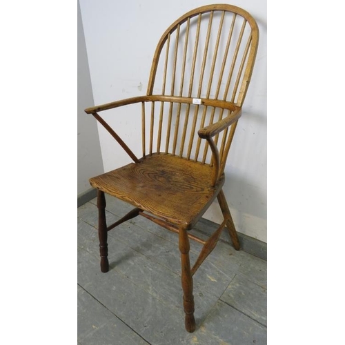 706 - An 18th century ash hoop back Windsor chair of good colour, on turned supports with an ‘H’ stretcher... 