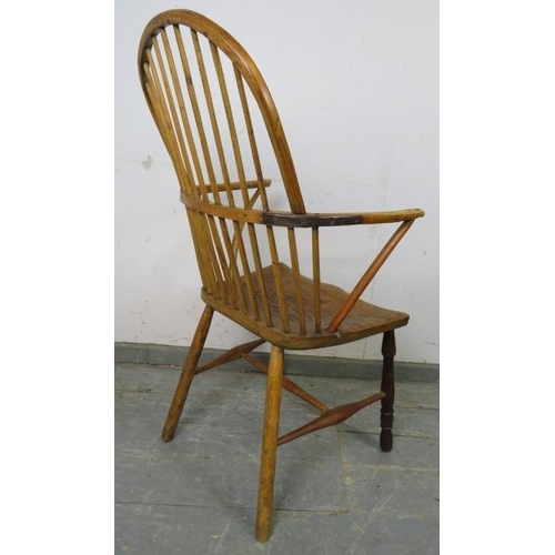 706 - An 18th century ash hoop back Windsor chair of good colour, on turned supports with an ‘H’ stretcher... 