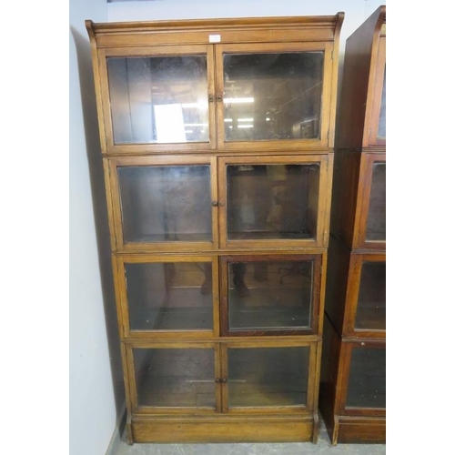 710 - A pair of early 20th century mahogany stacking solicitor’s bookcases, each comprising four sections ... 