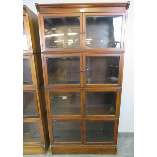 710 - A pair of early 20th century mahogany stacking solicitor’s bookcases, each comprising four sections ... 