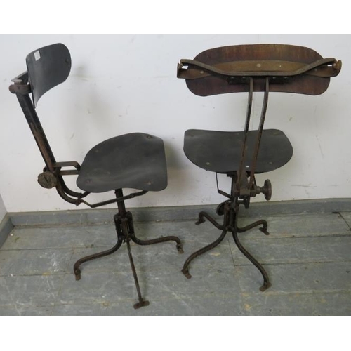 711 - A pair of early 20th century height-adjustable machinist’s stools, also having height-adjustable bac... 