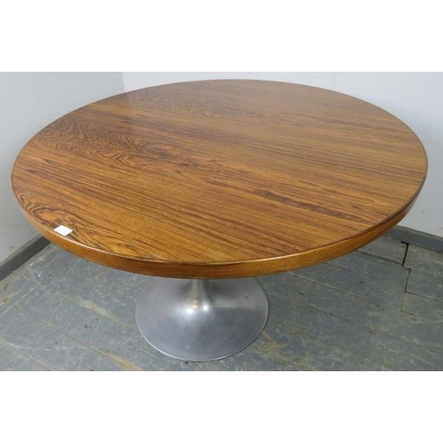 713 - A mid-century tropical hardwood ‘tulip’ circular dining table by Arkana, in the manner of Eero Saari... 