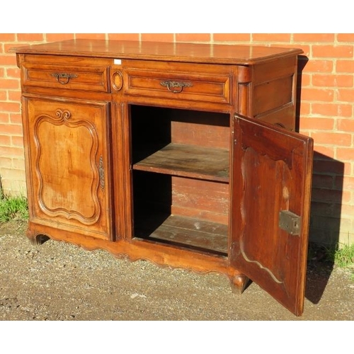 720 - An 18th century and later French fruitwood sideboard, housing two short drawers above cupboards with... 