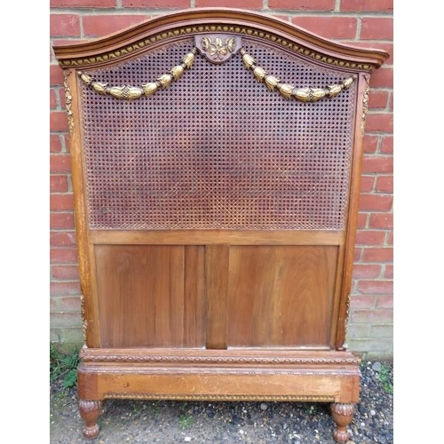 720A - A pair of antique French bergère and fruitwood single beds, the headboards with moulded cornices abo... 