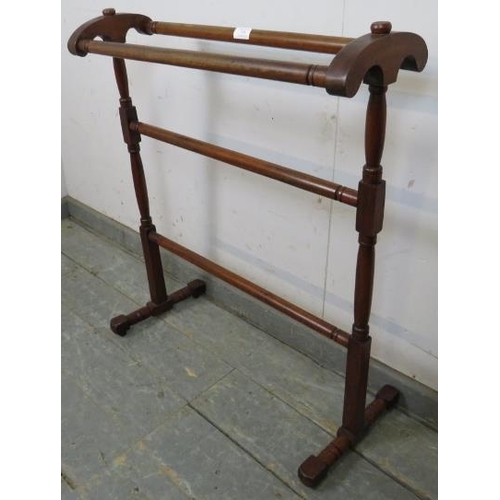 725 - A late 19th century mahogany double towel rail, on turned and block supports with splayed feet. 
H80... 