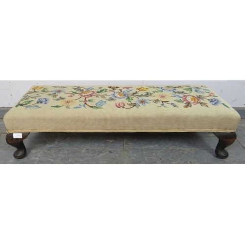 729 - An antique tapestry long footstool, on fruitwood ogee supports. c1920. 
H23cm W100cm D36cm (approx).... 