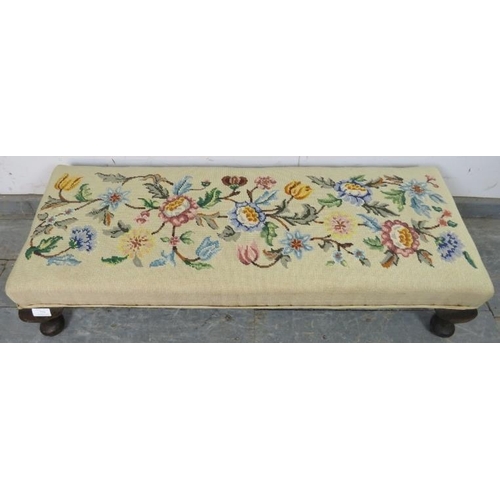 729 - An antique tapestry long footstool, on fruitwood ogee supports. c1920. 
H23cm W100cm D36cm (approx).... 