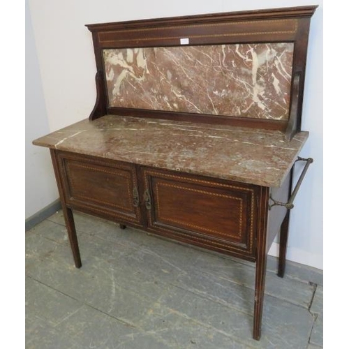 737 - An Edwardian mahogany washstand, parquetry strung and having rouge marble top and splash-back, above... 