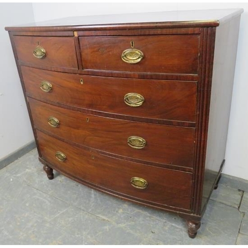 743 - A George III mahogany bow-fronted chest of two short over three long graduated cock-beaded drawers w... 