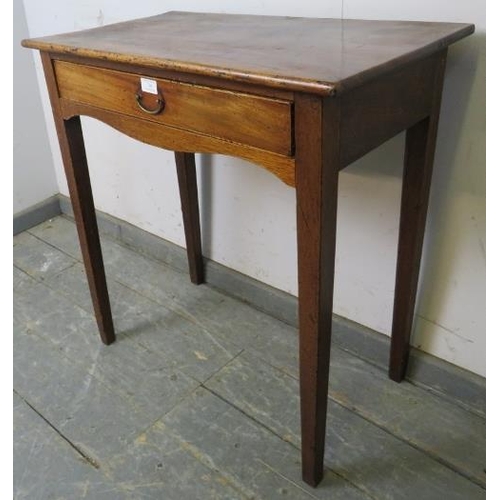 746 - A George III mahogany side table, having one long frieze drawer above shaped apron, on tapering squa... 