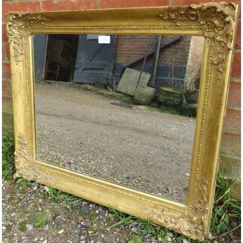 754 - An ornate 19th century moulded gilt gesso frame with later added mirror plate.
H61cm W74cm D6cm (app... 