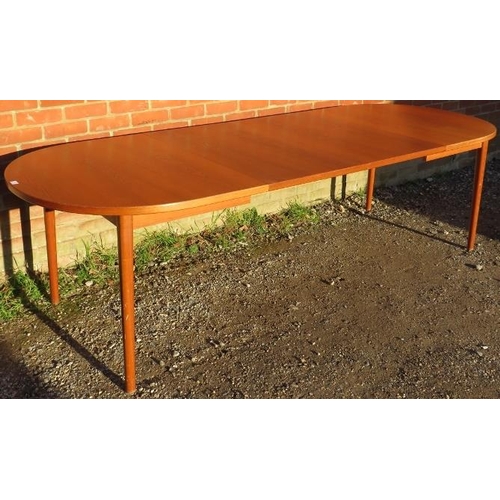 757 - A mid-century Scandinavian teak draw-leaf extending oval dining table by Troeds Bjarnum, on turned s... 