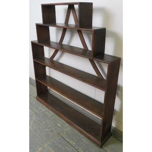 760 - An unusual 19th century mahogany stepped bookcase, of five open shelves with curved back braces, on ... 