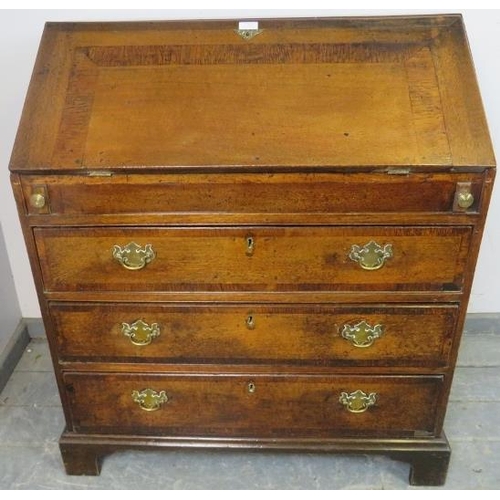 764 - An 18th century medium oak bureau, crossbanded and with olive wood inlay, the fall front enclosing a... 