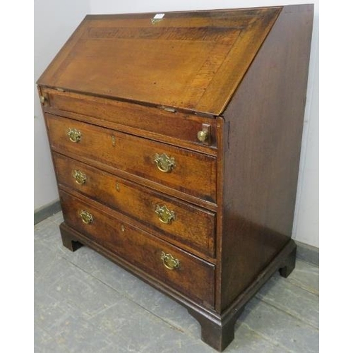 764 - An 18th century medium oak bureau, crossbanded and with olive wood inlay, the fall front enclosing a... 