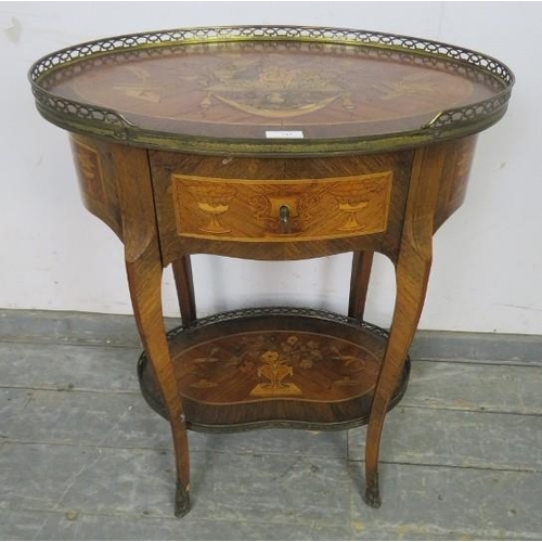 766 - A 19th century French tulipwood and kingwood crossbanded oval two-tier table, having profuse marquet... 