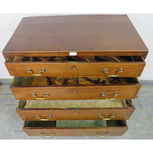 767 - An 18th century mahogany chest of small proportions, housing four long drawers with satinwood bandin... 