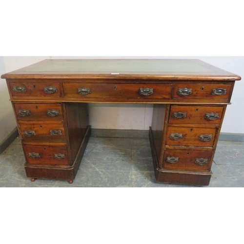 768 - A late Victorian mahogany pedestal desk, the inset green leather writing surface above a configurati... 