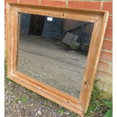 769 - An antique pitch pine wall mirror within a moulded rectangular surround. 
H70cm W80cm D7cm (approx).... 