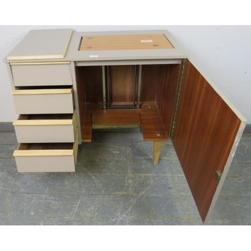 770 - A mid-century sewing table painted grey, the louvred front enclosing four blind drawers, opposite a ... 