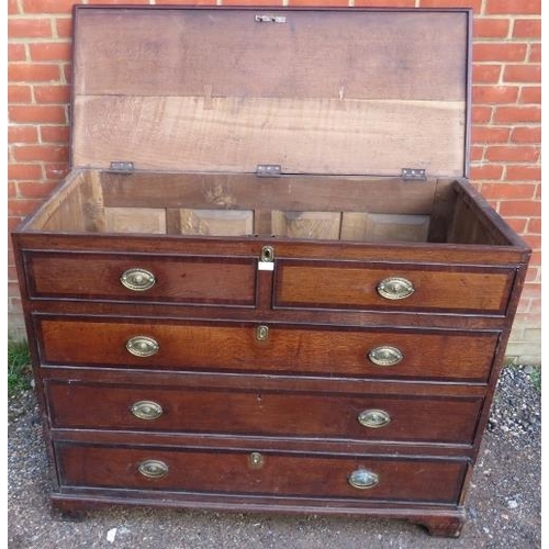 775 - A substantial George III oak mule chest, crossbanded and inlaid with mahogany and ebony, the hinged ... 