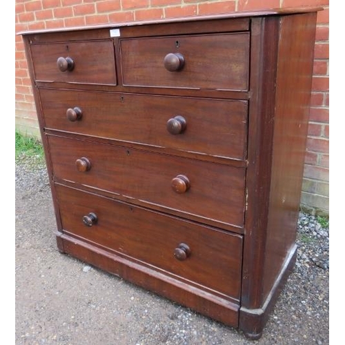 776 - A Victorian mahogany chest of two short above three long graduated drawers with turned wooden handle... 