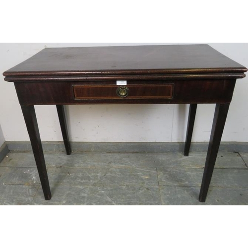 778 - A Georgian mahogany turnover tea table, having a single drawer with banded inlay, on tapering square... 