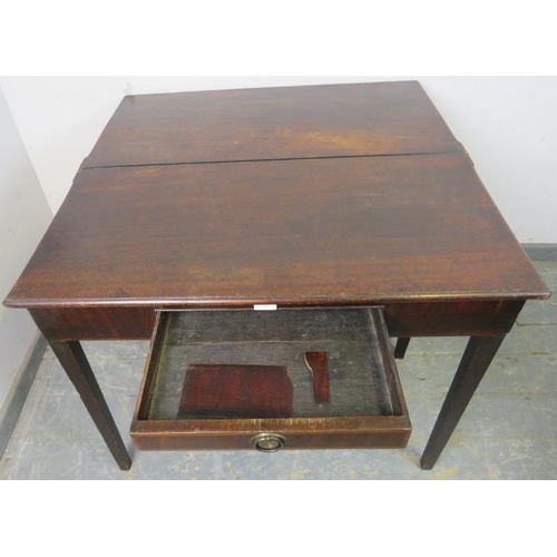 778 - A Georgian mahogany turnover tea table, having a single drawer with banded inlay, on tapering square... 