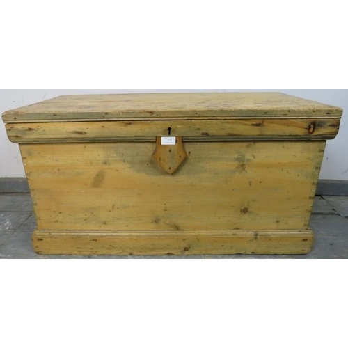 779 - An antique pine flat topped trunk/blanket box, having carry handles to either side, on a plinth base... 