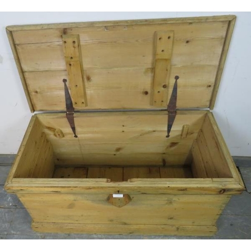 779 - An antique pine flat topped trunk/blanket box, having carry handles to either side, on a plinth base... 