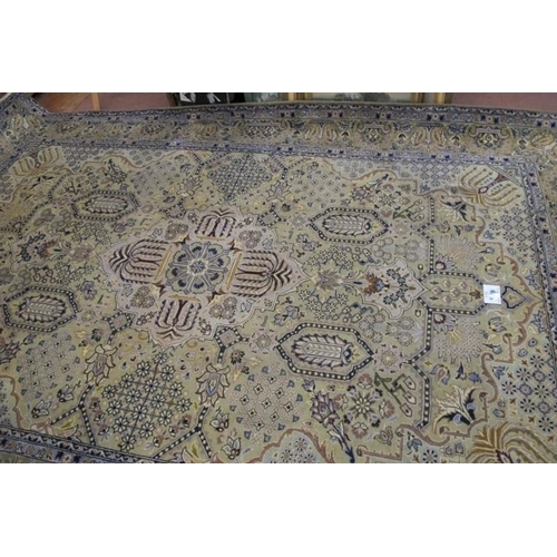 915 - Central Persian Kashmar carpet. Central motif and a repeat pattern central field on cream ground. 40... 